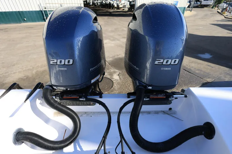Slide: The Image of Twin Yamaha 200 engines on a 2021 Sportsman Heritage 251 Center Console boat. - 33