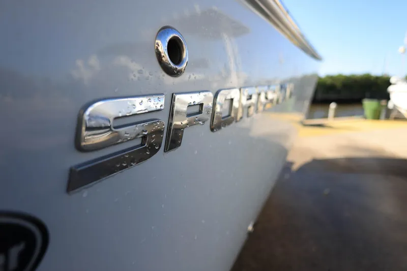 Slide: The Image of Close-up of 2021 Sportsman Heritage 251 Center Console boat logo with water droplets. - 34