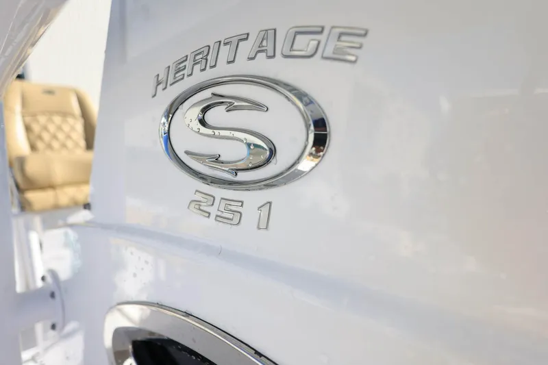 Slide: The Image of 2021 Sportsman Heritage 251 Center Console logo on boat exterior. - 35