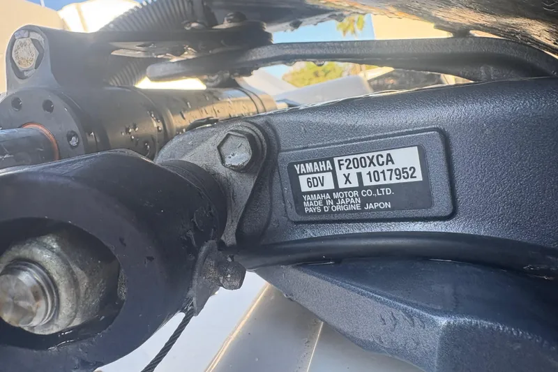 Slide: The Image of Close-up of Yamaha F200XCA engine part on 2021 Sportsman Heritage 251 Center Console. - 37