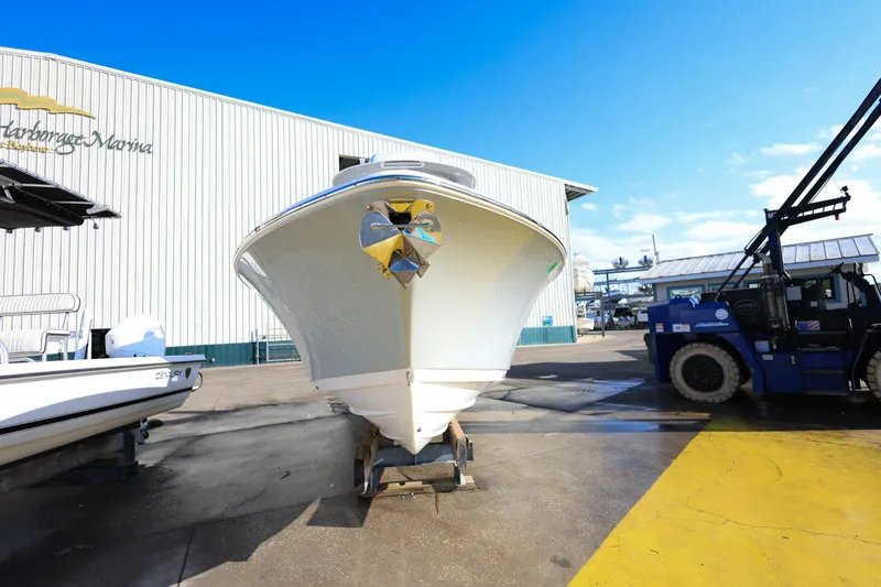 Slide: The Image of 2021 Sportsman Heritage 251 Center Console boat at a marina, front view. - 4