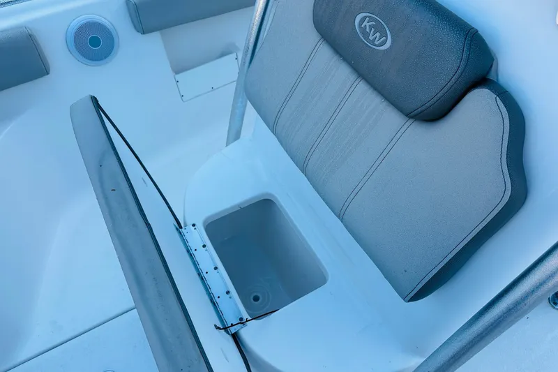 Slide: The Image of 2022 Key West 239 FS boat seat with storage compartment open. - 17