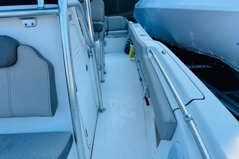 Slide: The Image of 2022 Key West 239 FS boat interior with seating and railings. - 19