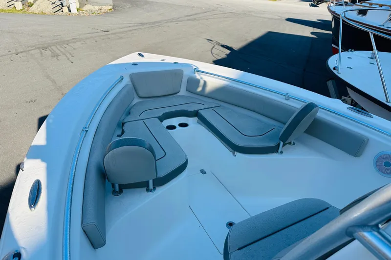 Slide: The Image of 2022 Key West 239 FS boat interior with cushioned seating and spacious layout. - 20