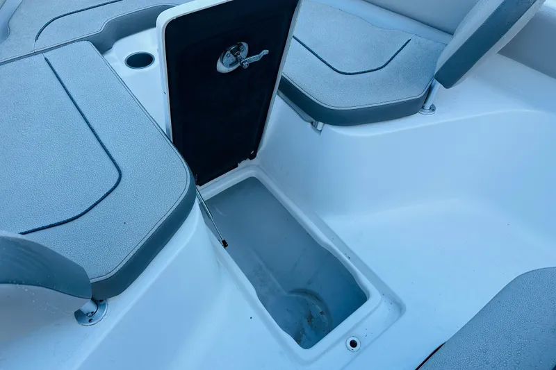 Slide: The Image of 2022 Key West 239 FS boat interior storage compartment with seating. - 21