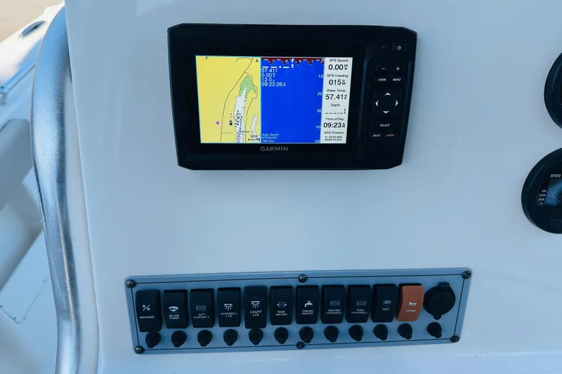 Slide: The Image of Garmin GPS display and control panel on 2022 Key West 239 FS boat dashboard. - 25