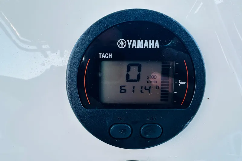 Slide: The Image of Yamaha tachometer displaying 0 RPM and 614.4 hours on Key West 239 FS, 2022 model. - 26