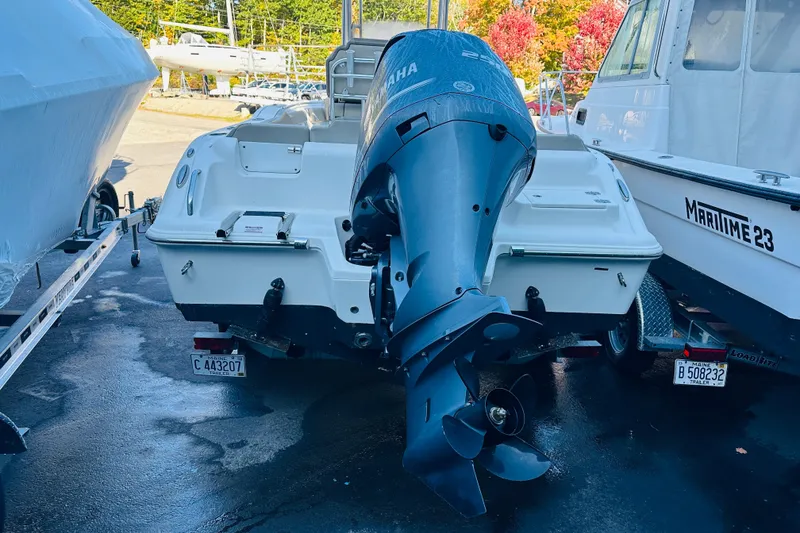 Slide: The Image of 2022 Key West 239 FS boat with Yamaha outboard motor, parked on a trailer. - 3