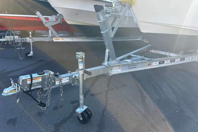 Slide: The Image of Trailer for 2022 Key West 239 FS boat, parked on asphalt. - 31