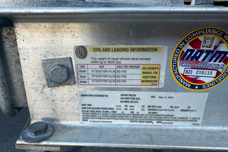 Slide: The Image of Tire and loading information on 2022 Key West 239 FS trailer, compliance sticker visible. - 32