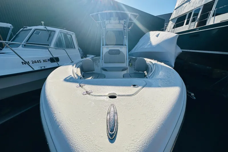 Slide: The Image of 2022 Key West 239 FS boat with morning dew, docked alongside other vessels. - 6