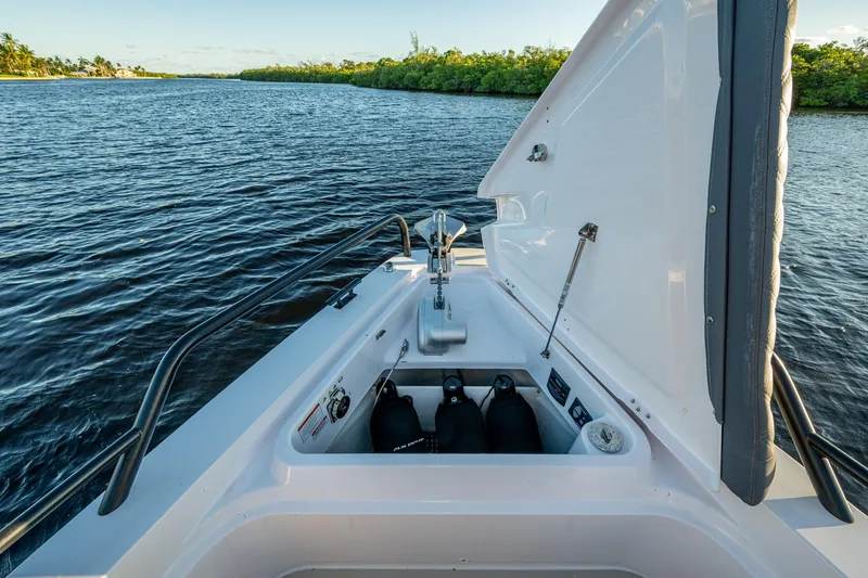Slide: The Image of 2021 Axopar 37 boat storage compartment with scenic waterway view. - 12