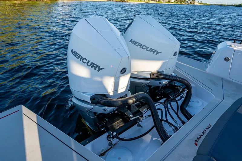 Slide: The Image of 2021 Axopar 37 boat with dual Mercury outboard engines on water. - 20
