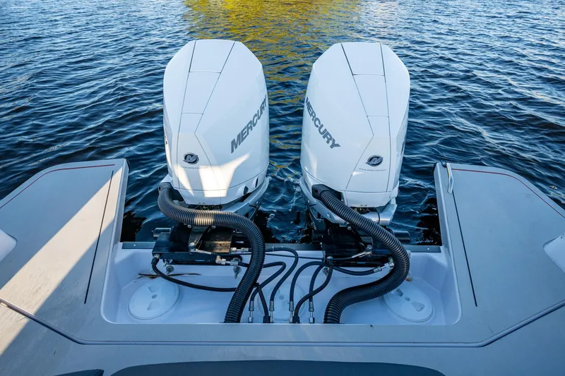 Slide: The Image of 2021 Axopar 37 boat with dual Mercury outboard engines on water. - 21