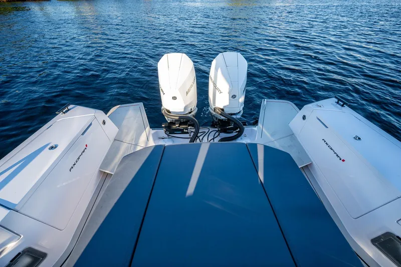 Slide: The Image of 2021 Axopar 37 boat with dual Mercury outboard engines on water. - 32