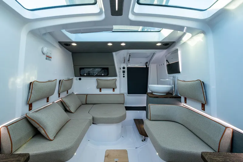 Slide: The Image of Luxurious interior of 2021 Axopar 37 boat with modern seating and skylights. - 8