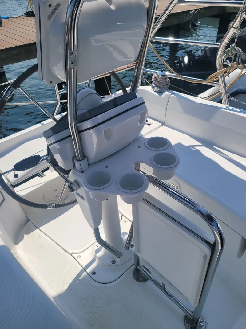 Slide: The Image of Cockpit of 2008 Hunter 33 sailboat with steering wheel and cup holders. - 14