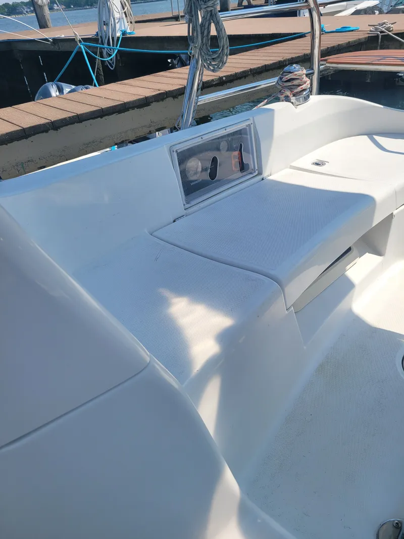 Slide: The Image of Cockpit seating area of a 2008 Hunter 33 sailboat at a dock. - 4