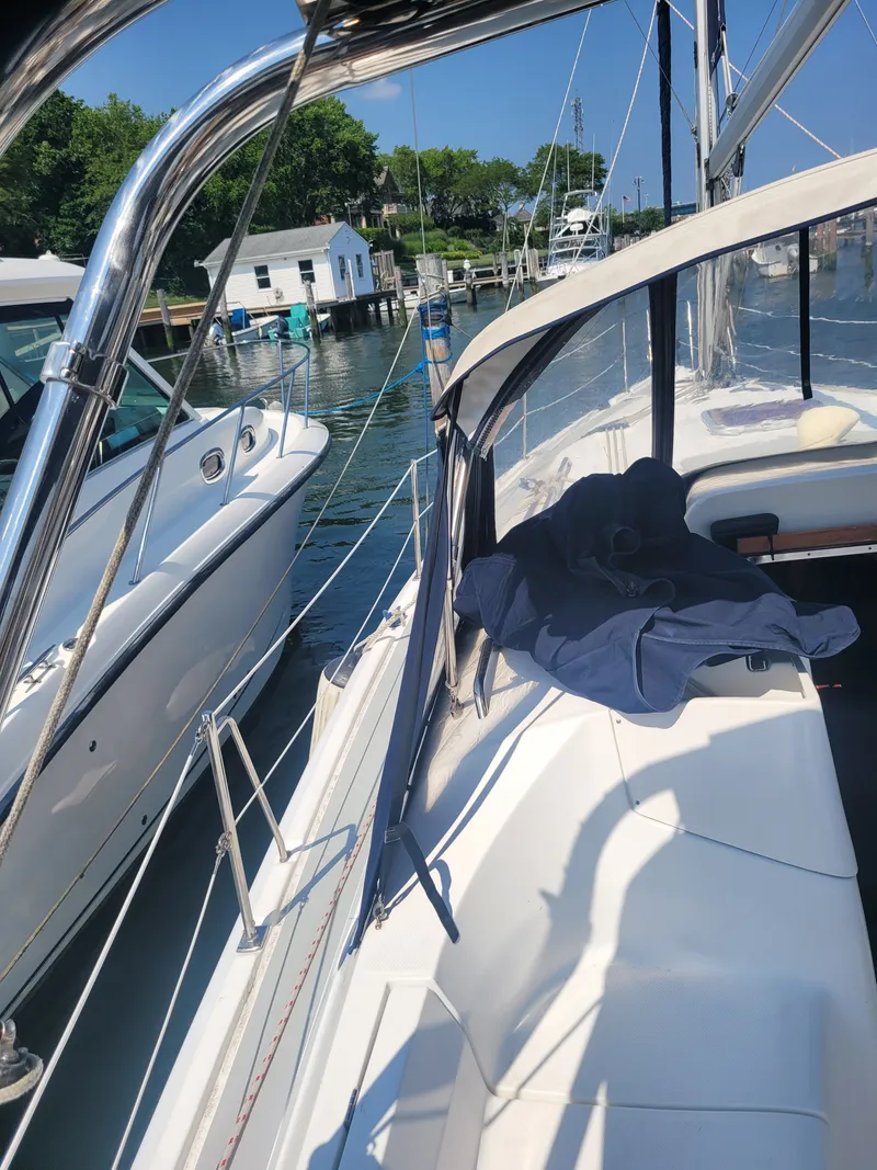 Slide: The Image of 2008 Hunter 33 sailboat docked at marina on a sunny day. - 8