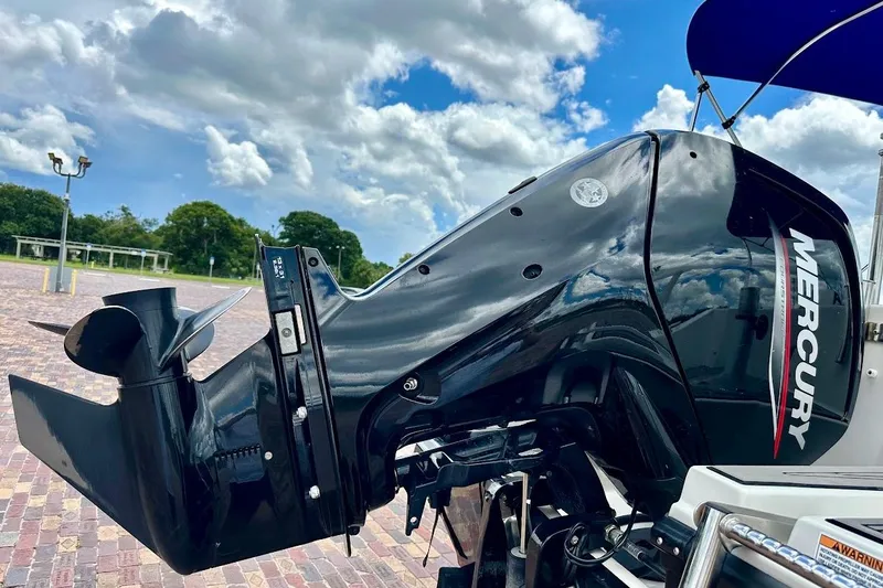 Slide: The Image of 2023 Starcraft SVX 171 OB with Mercury outboard motor under a cloudy sky. - 14