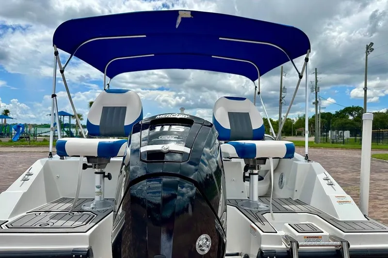 Slide: The Image of 2023 Starcraft SVX 171 OB boat with Mercury 115 engine and blue canopy. - 20