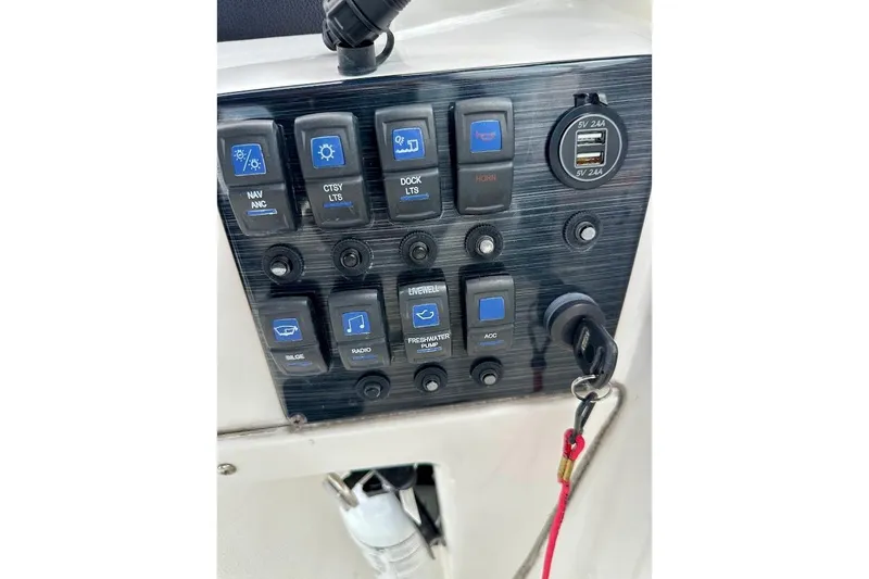 Slide: The Image of Control panel of 2023 Starcraft SVX 171 OB boat with switches and USB ports. - 35