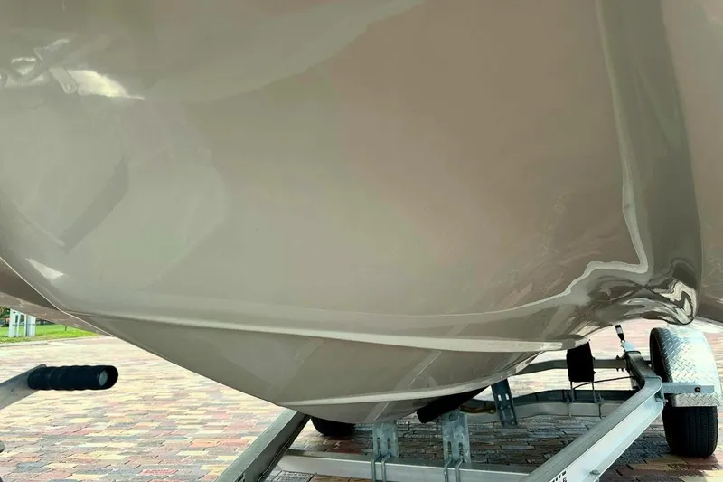 Slide: The Image of 2023 Starcraft SVX 171 OB boat hull on a trailer, close-up view. - 8