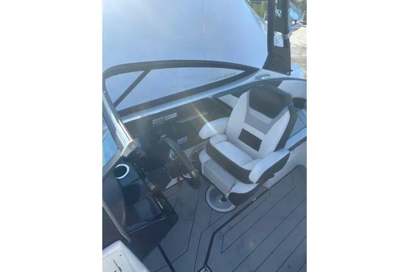 Slide: The Image of 2021 Yamaha Boats 212XE interior with sleek seating and modern design elements. - 15