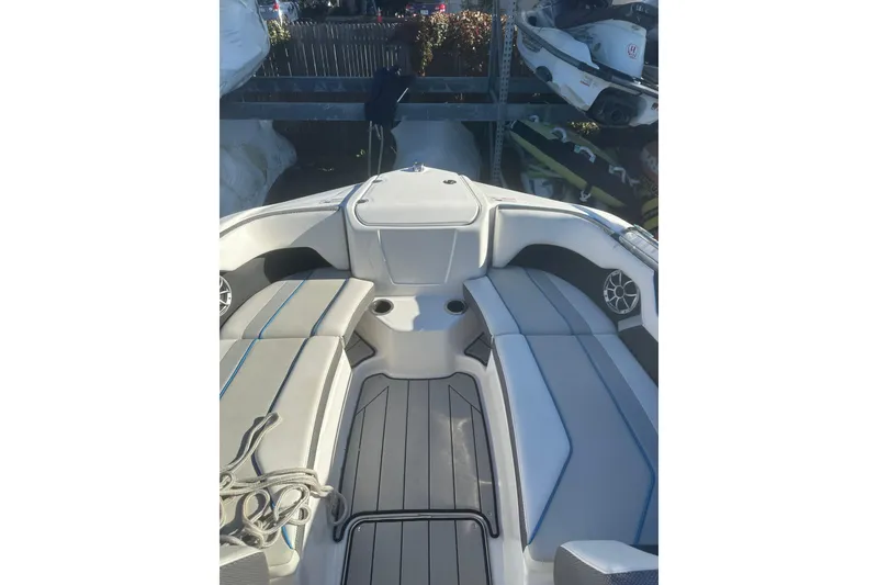 Slide: The Image of 2021 Yamaha Boats 212XE interior with sleek seating and modern design. - 18