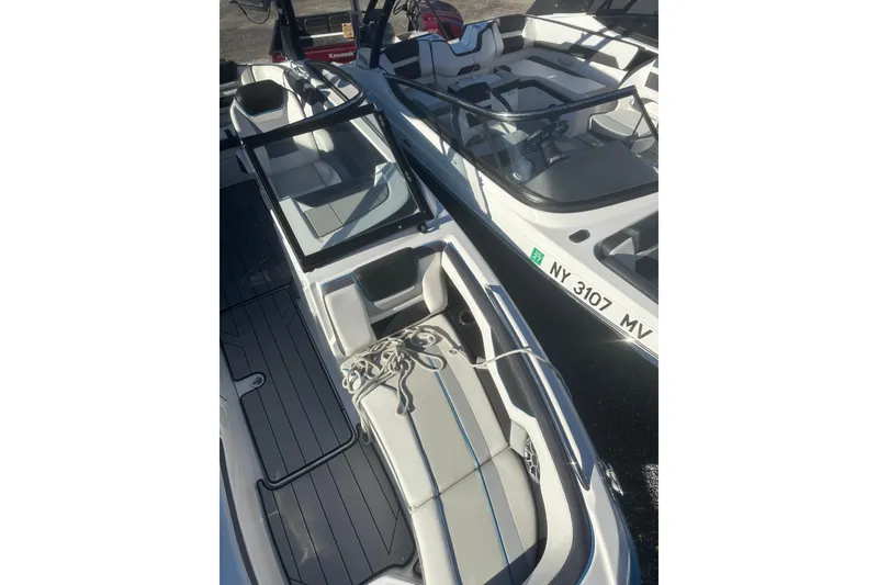 Slide: The Image of 2021 Yamaha Boats 212XE interior with seating and open deck view. - 20