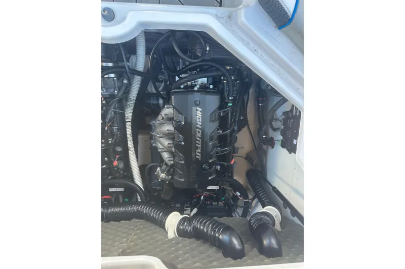 Slide: The Image of 2021 Yamaha Boats 212XE engine compartment showcasing high output engine components. - 22