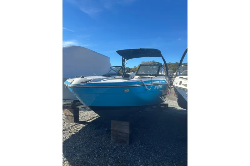 Slide: The Image of 2021 Yamaha Boats 212XE interior with sleek seating and modern dashboard. - 4