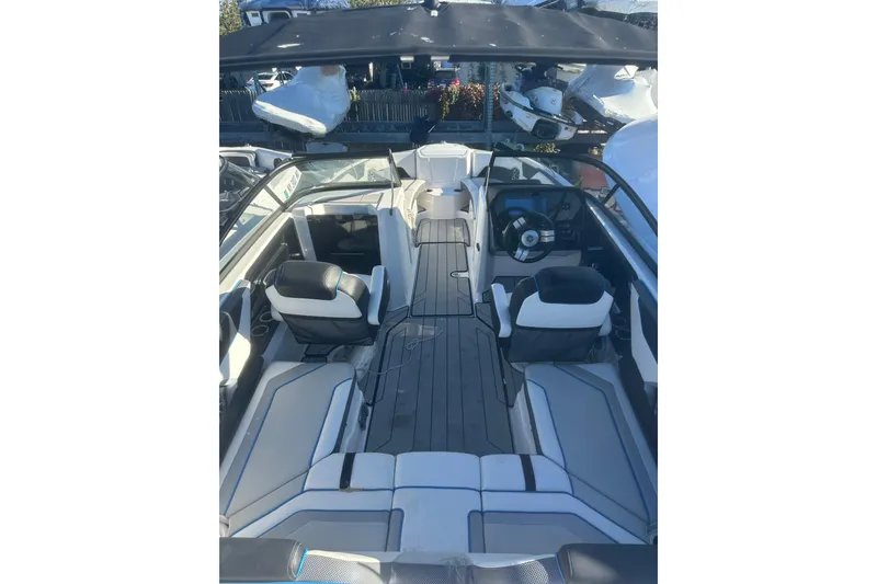 Slide: The Image of Interior seating of 2021 Yamaha Boats 212XE, featuring sleek design and comfortable upholstery. - 5