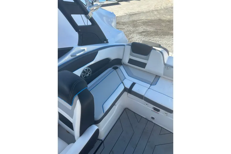 Slide: The Image of 2021 Yamaha Boats 212XE interior with sleek seating and modern design. - 6