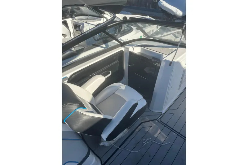 Slide: The Image of 2021 Yamaha Boats 212XE interior with sleek seating and modern design. - 8
