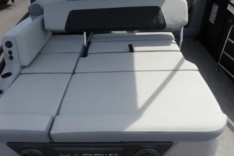 Slide: The Image of 2026 Harris Solstice 250 boat interior with spacious cushioned seating area. - 16