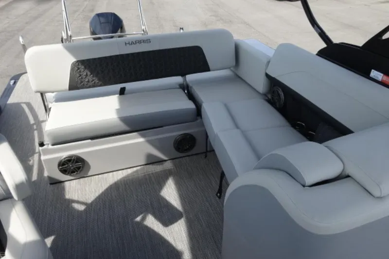 Slide: The Image of 2026 Harris Solstice 250 boat interior with gray seating and built-in speakers. - 5