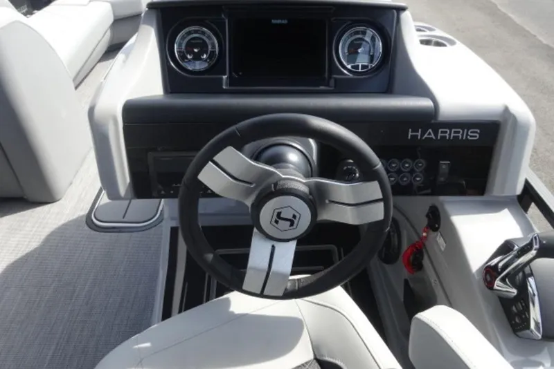 Slide: The Image of 2026 Harris Solstice 250 boat dashboard with steering wheel and control panel. - 8