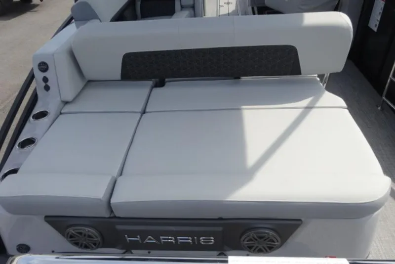 Slide: The Image of 2026 Harris Solstice 250 boat seating area with integrated speakers and cup holders. - 9