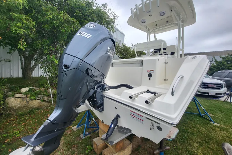 Slide: The Image of 2025 Cobia 220 Center Console boat with Yamaha 200 outboard engine. - 1