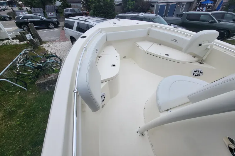 Slide: The Image of 2025 Cobia 220 Center Console boat interior with seating and storage compartments. - 13