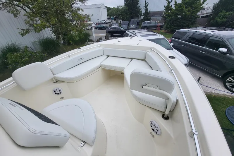 Slide: The Image of 2025 Cobia 220 Center Console boat with spacious seating and modern design. - 15