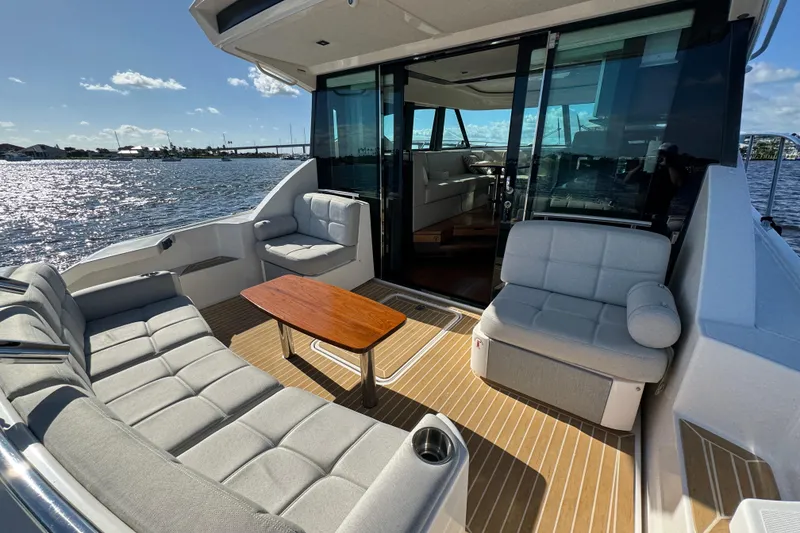 Slide: The Image of Luxurious 2016 Tiara Yachts C44 Coupe with elegant outdoor seating and scenic water view. - 26