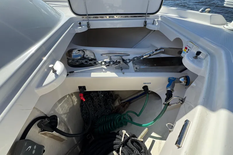 Slide: The Image of 2016 Tiara Yachts C44 Coupe anchor locker with chains and hoses. - 33