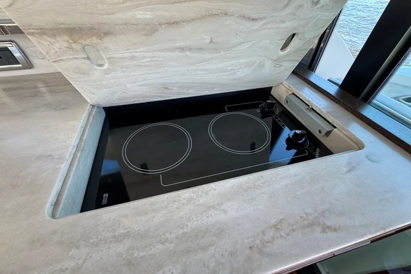 Slide: The Image of Modern stovetop on 2016 Tiara Yachts C44 Coupe, featuring sleek design and functionality. - 40