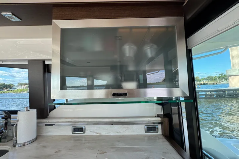 Slide: The Image of Interior view of 2016 Tiara Yachts C44 Coupe, featuring a modern kitchen area. - 41