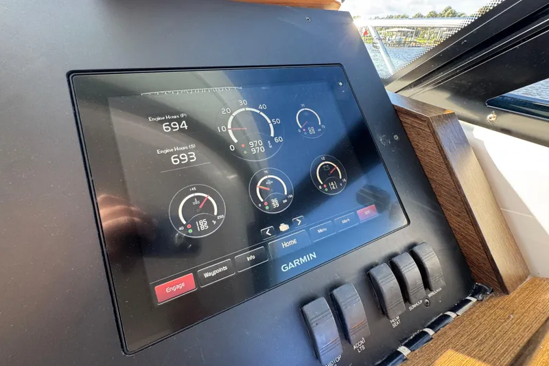 Slide: The Image of Dashboard of 2016 Tiara Yachts C44 Coupe with Garmin display showing engine data. - 48
