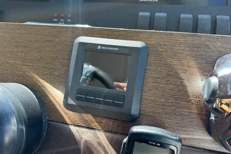 Slide: The Image of Seakeeper control panel on 2016 Tiara Yachts C44 Coupe dashboard. - 49