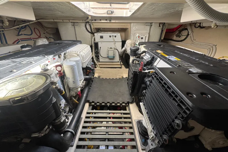 Slide: The Image of Engine room of 2016 Tiara Yachts C44 Coupe, showcasing dual engines and mechanical components. - 72