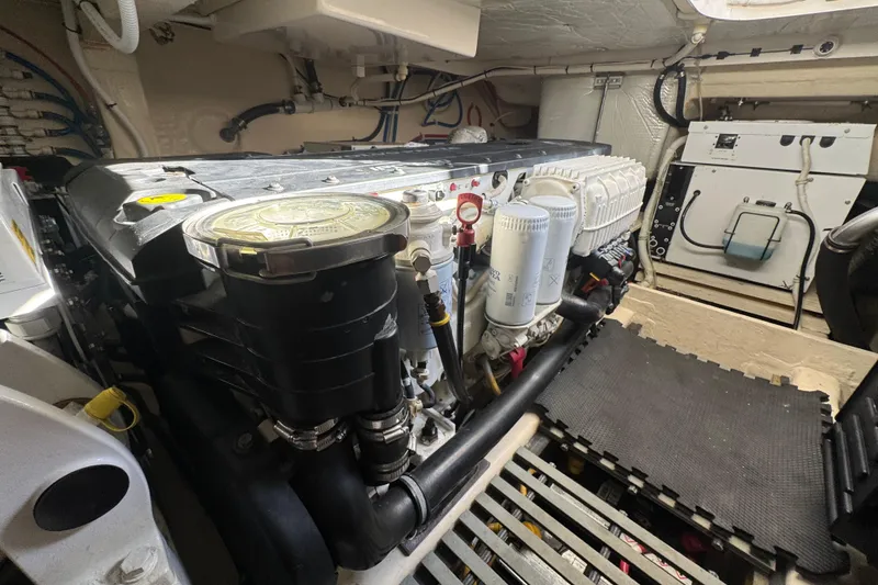 Slide: The Image of Engine room of 2016 Tiara Yachts C44 Coupe, showcasing detailed mechanical components. - 73